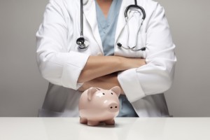 Doctor with piggybank