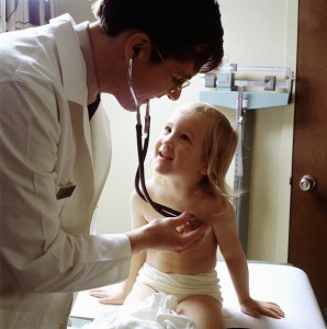 Pediatrician with patient